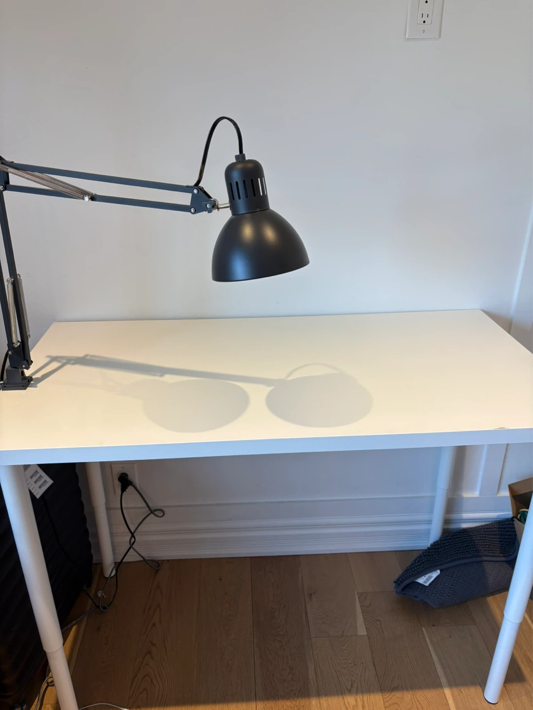 White IKEA Desk with Adjustable Lamp