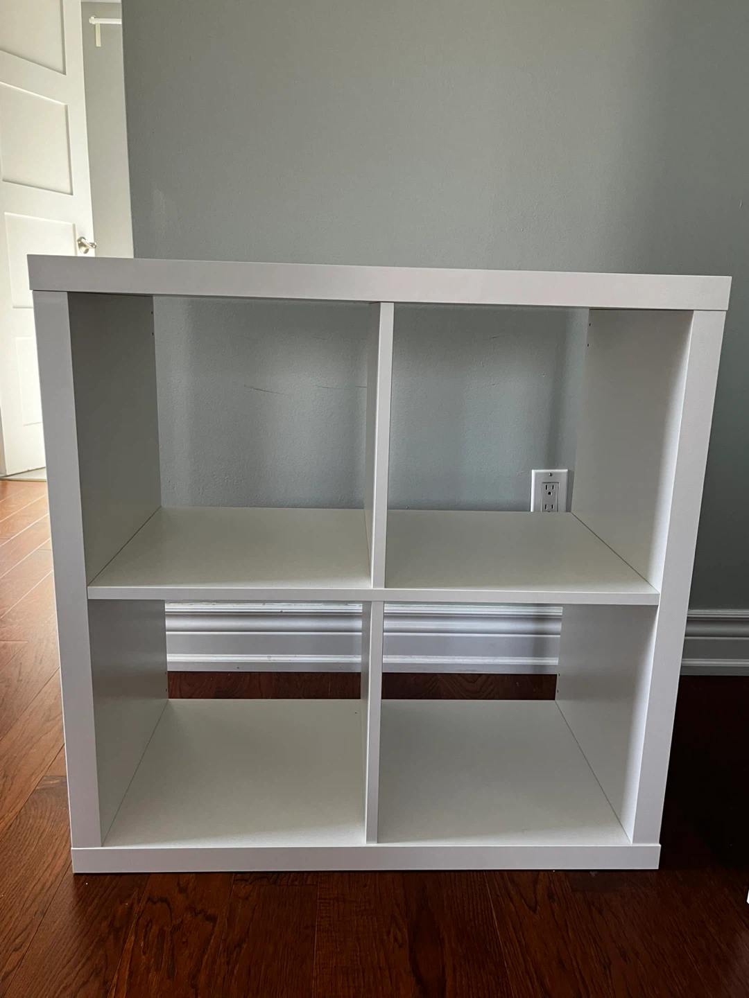 Three square white Ikea Kallax