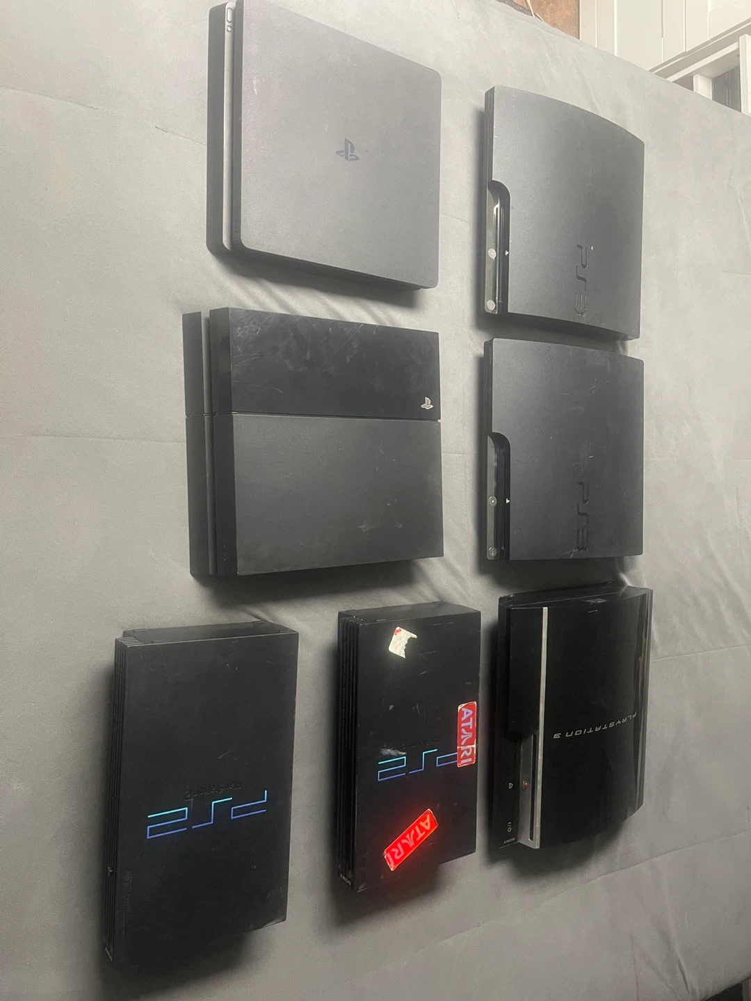 Sony PlayStation 2, 3, and 4 Consoles with Accessories