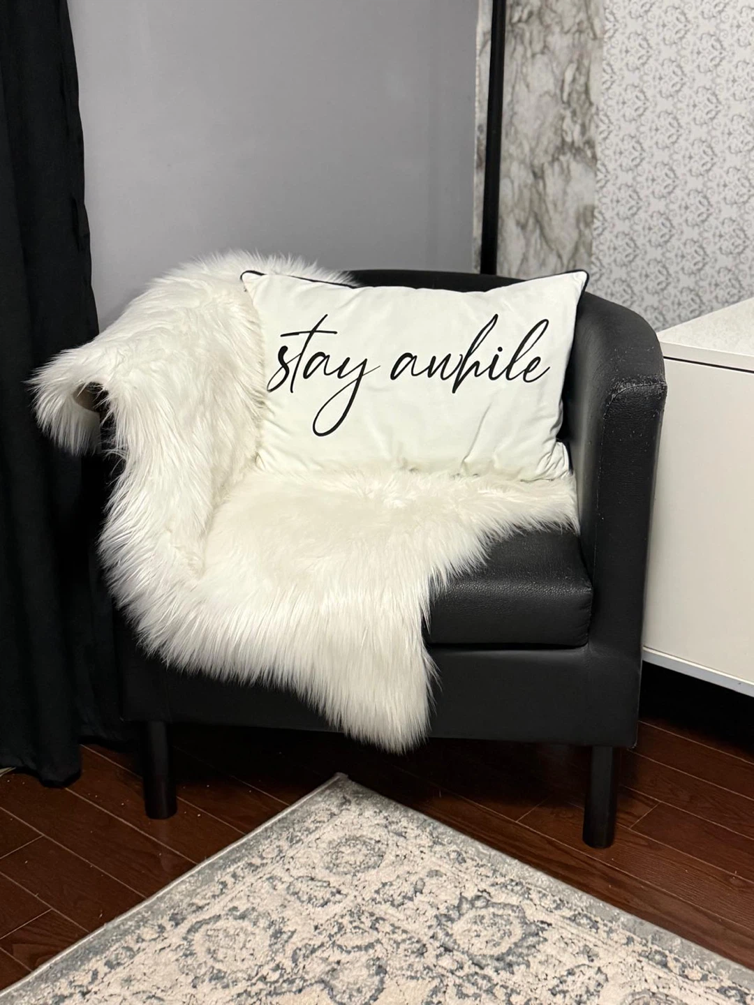 Black accent chair with "stay awhile" pillow - photo 2