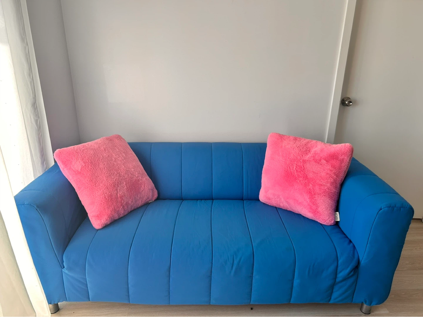 Blue Sofa with Pink Pillows