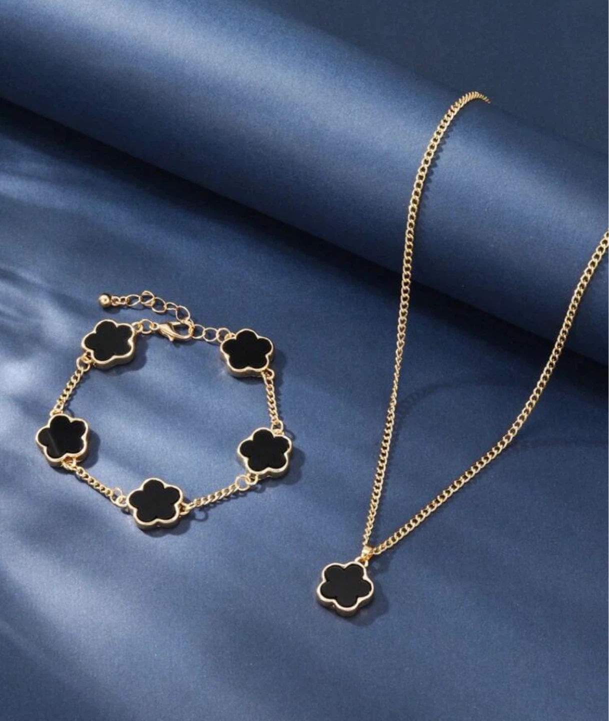 Gold-tone necklace and bracelet set with black clover charms - photo 2