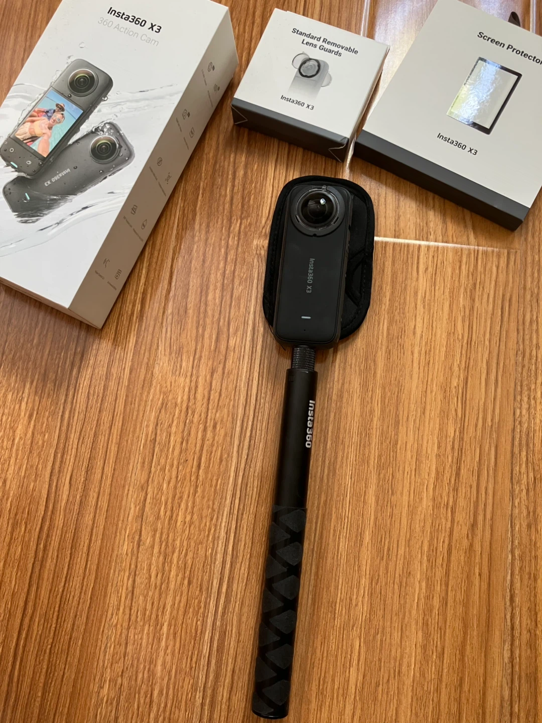 Insta360 X3 action camera with SD card and accessories