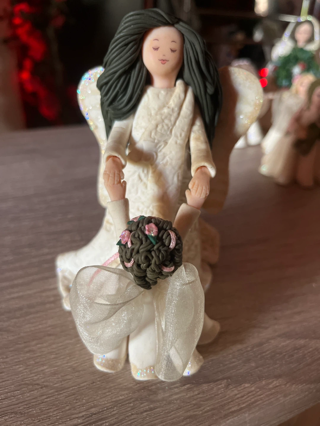 Angel figurine holding hands with child - photo 3