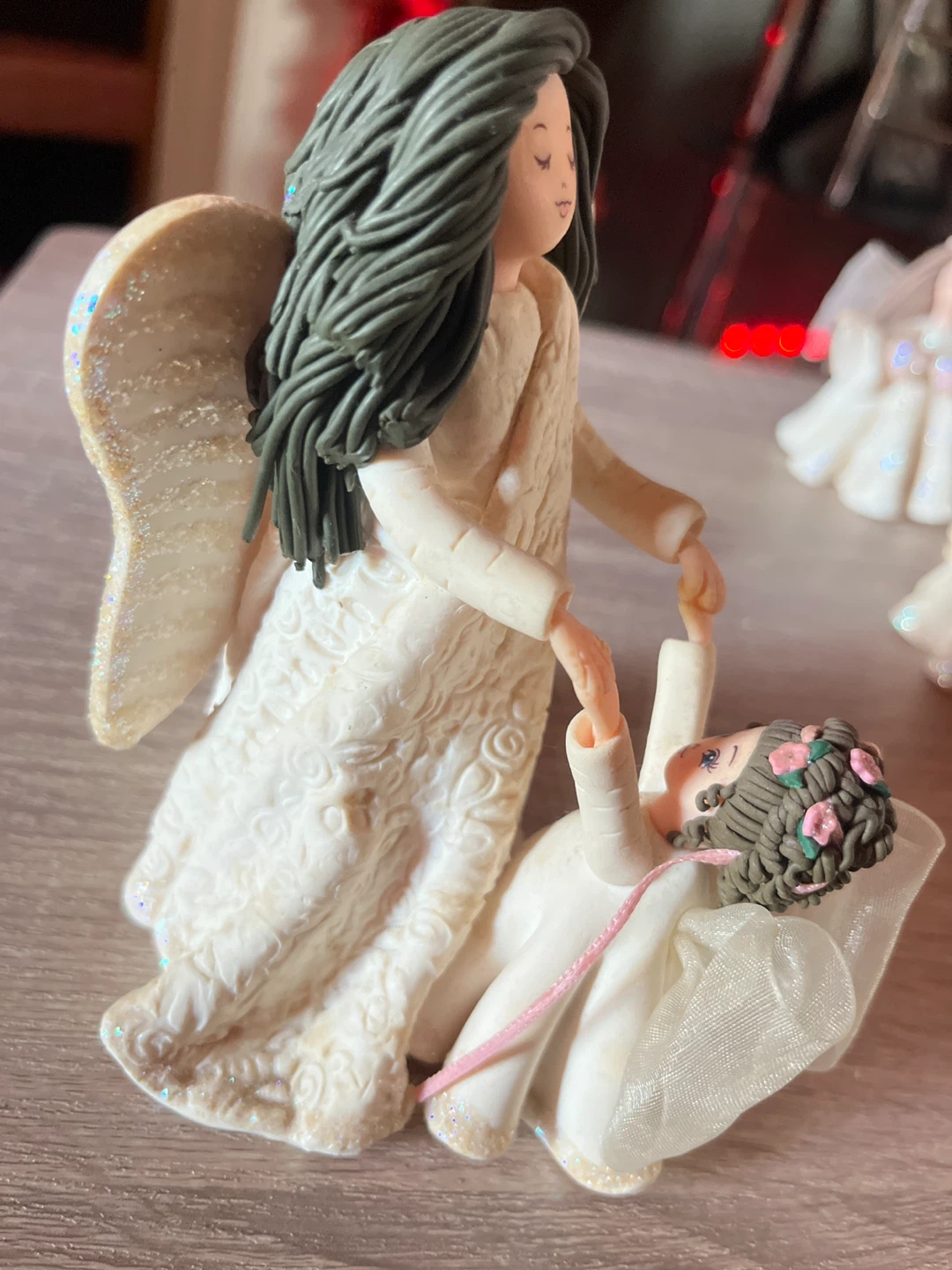 Angel figurine holding hands with child - photo 5