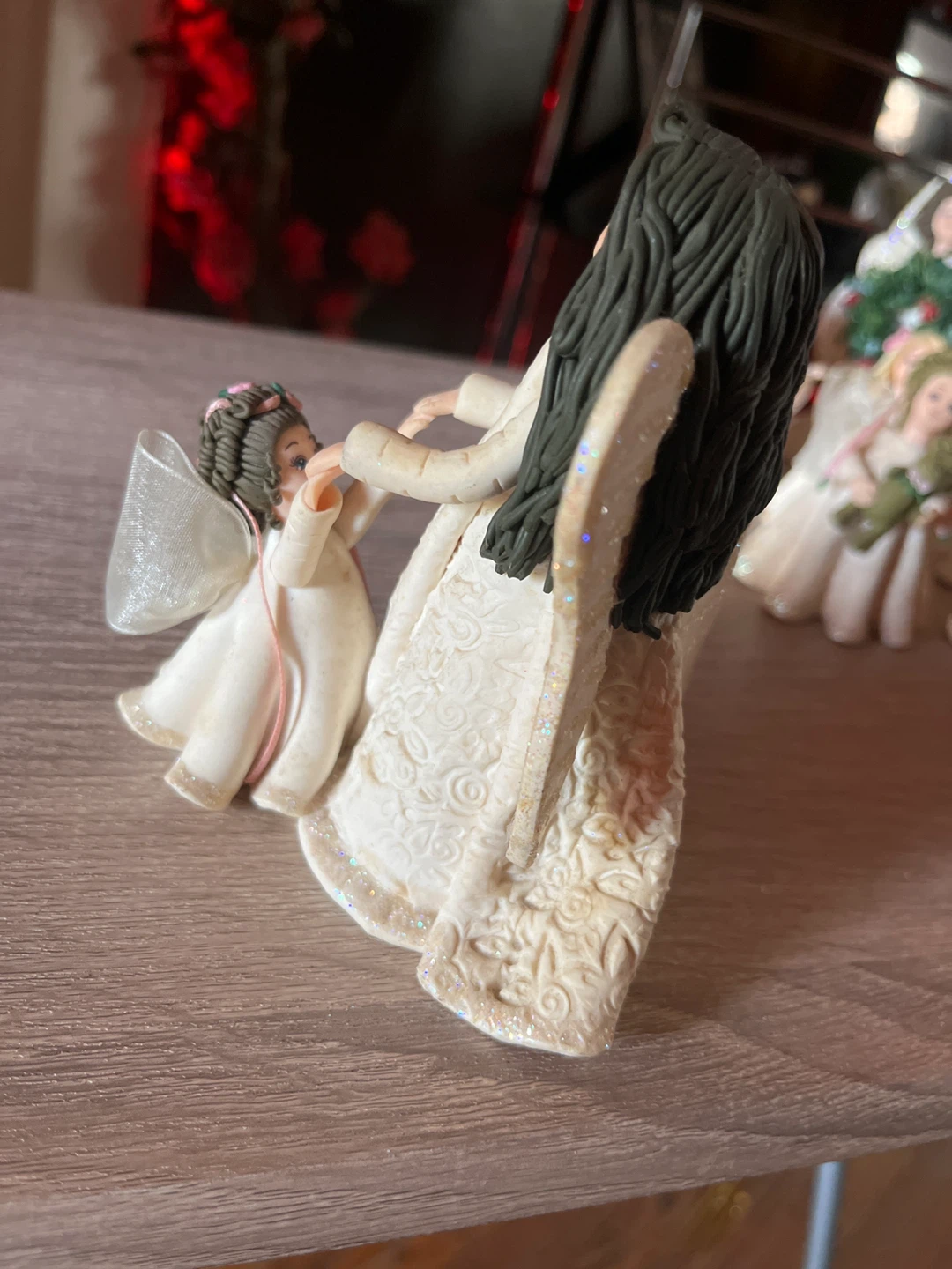 Angel figurine holding hands with child - photo 4