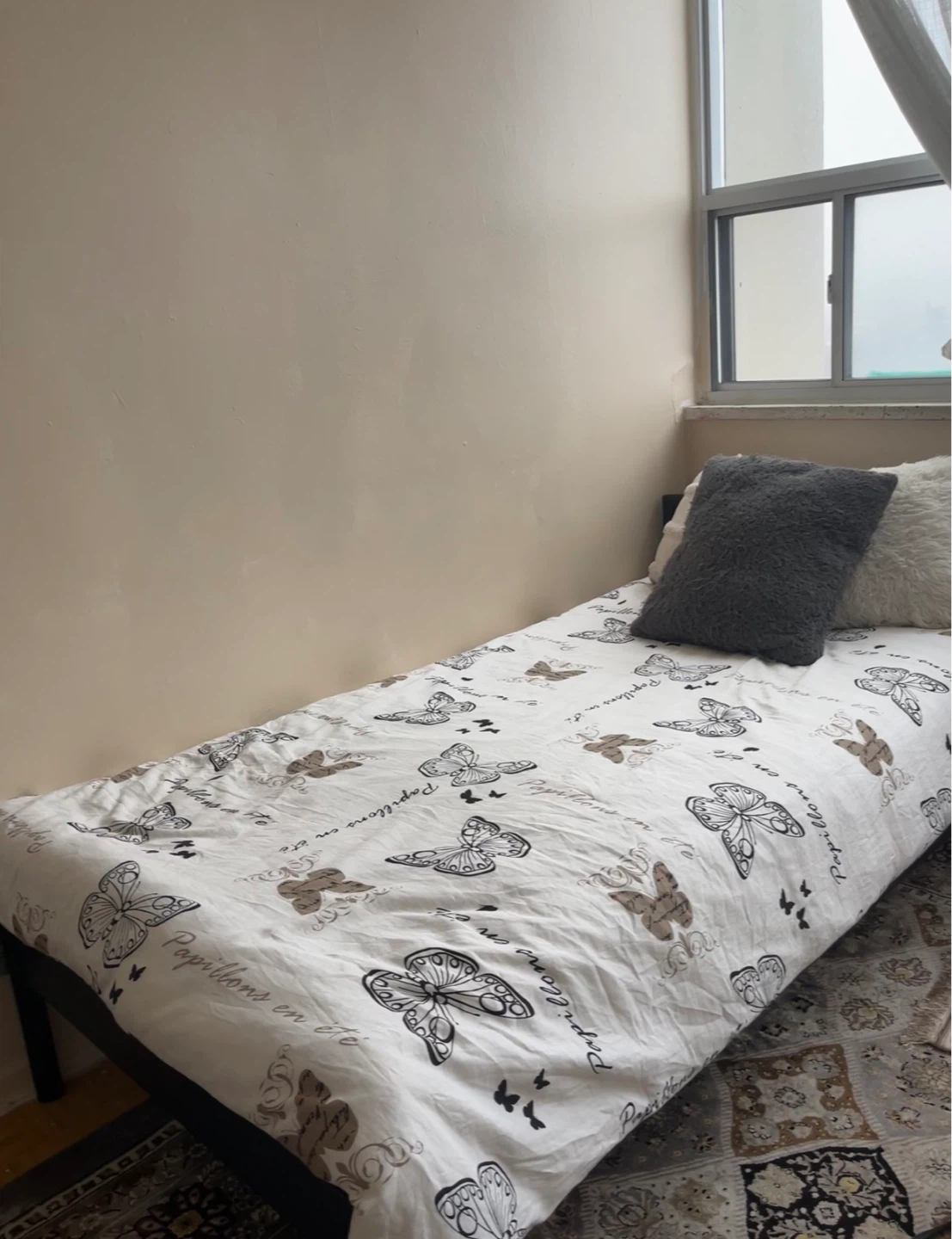 Twin bed + Bedding Set with Butterfly Print + the twin bed