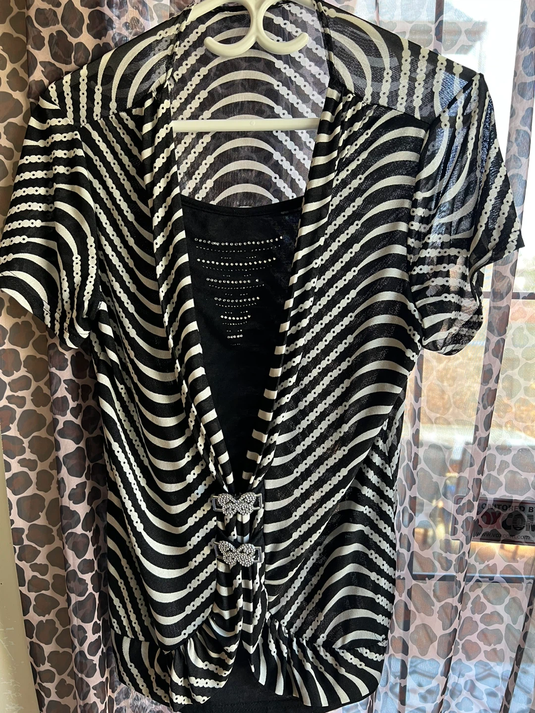 Black and White Striped Top with Butterfly Embellishments