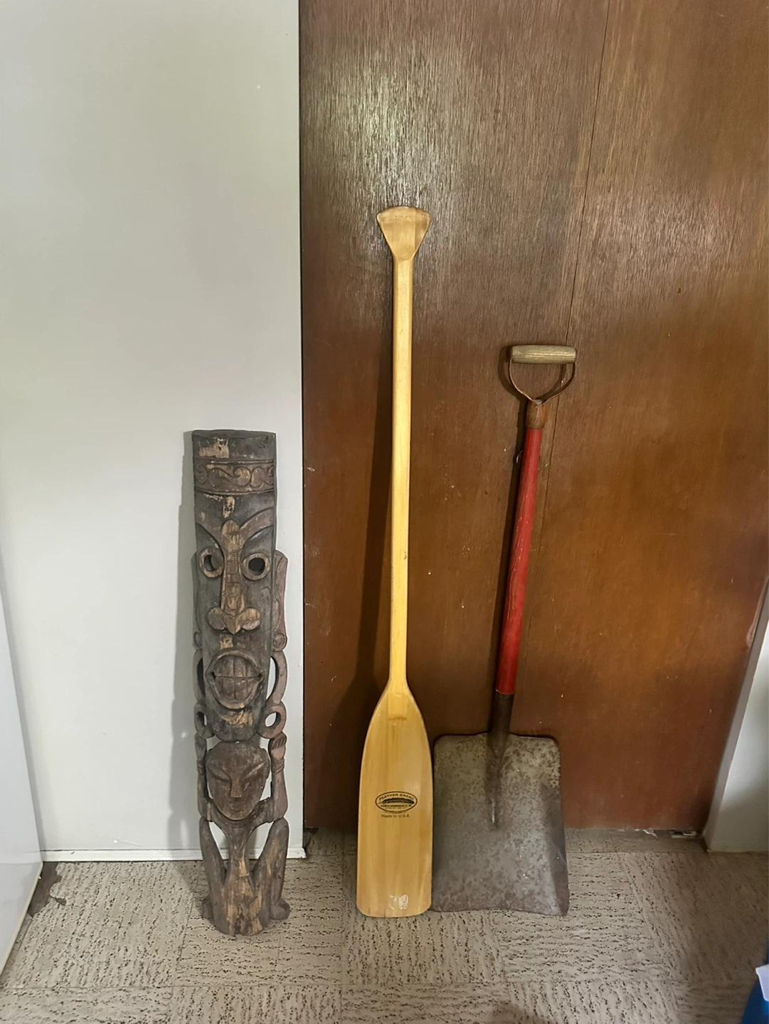 Ore , shovel , tiki carving