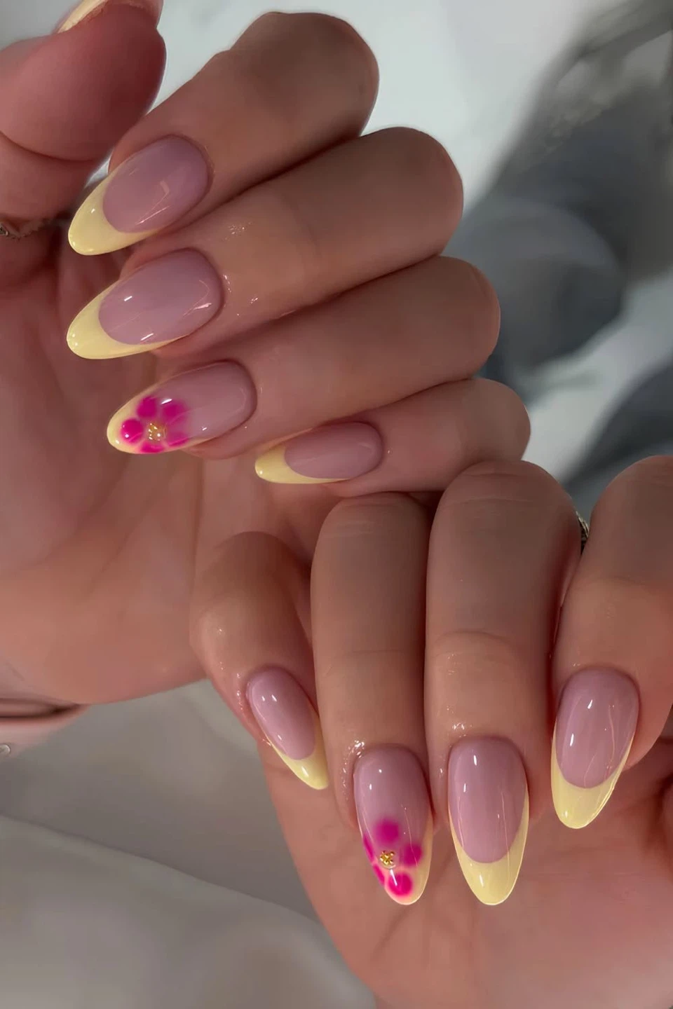 French Tip Almond Nails with Flower Accent