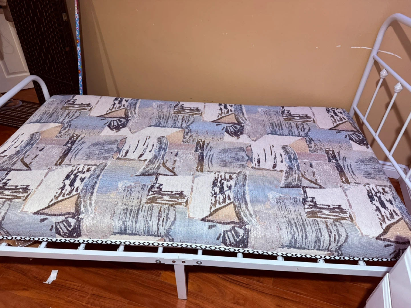 White Metal Frame Bed with Patterned Mattress