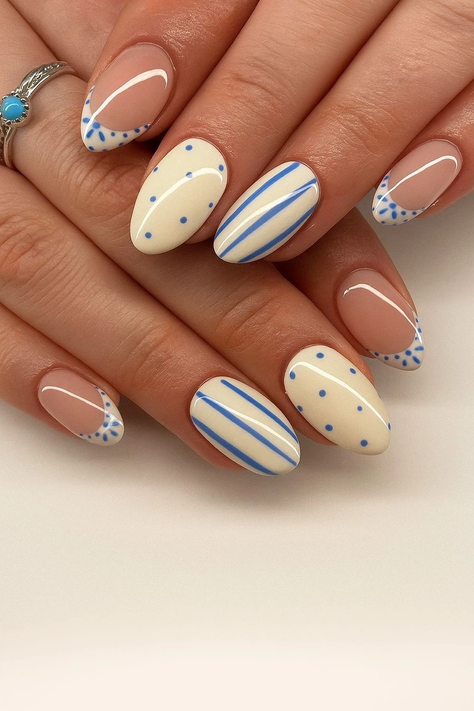 Custom French Tip Almond Nails with Blue Polka Dots and Stripes