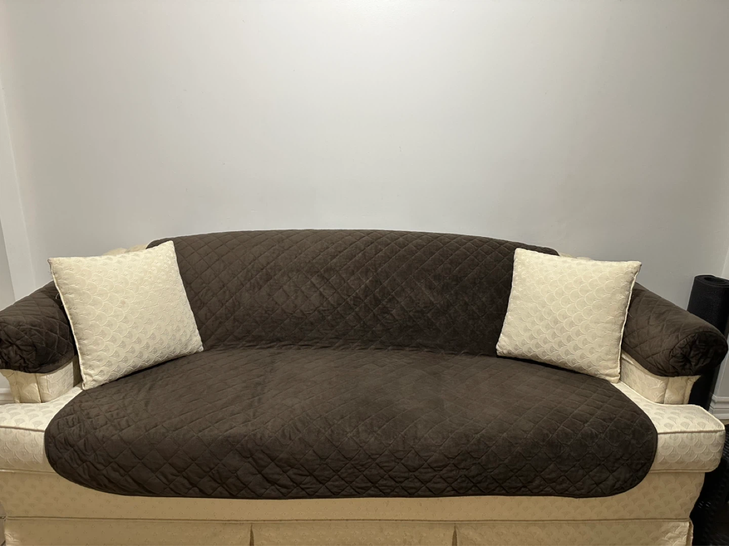 Cream Damask Sofa with Brown Quilted Cover and Pillows