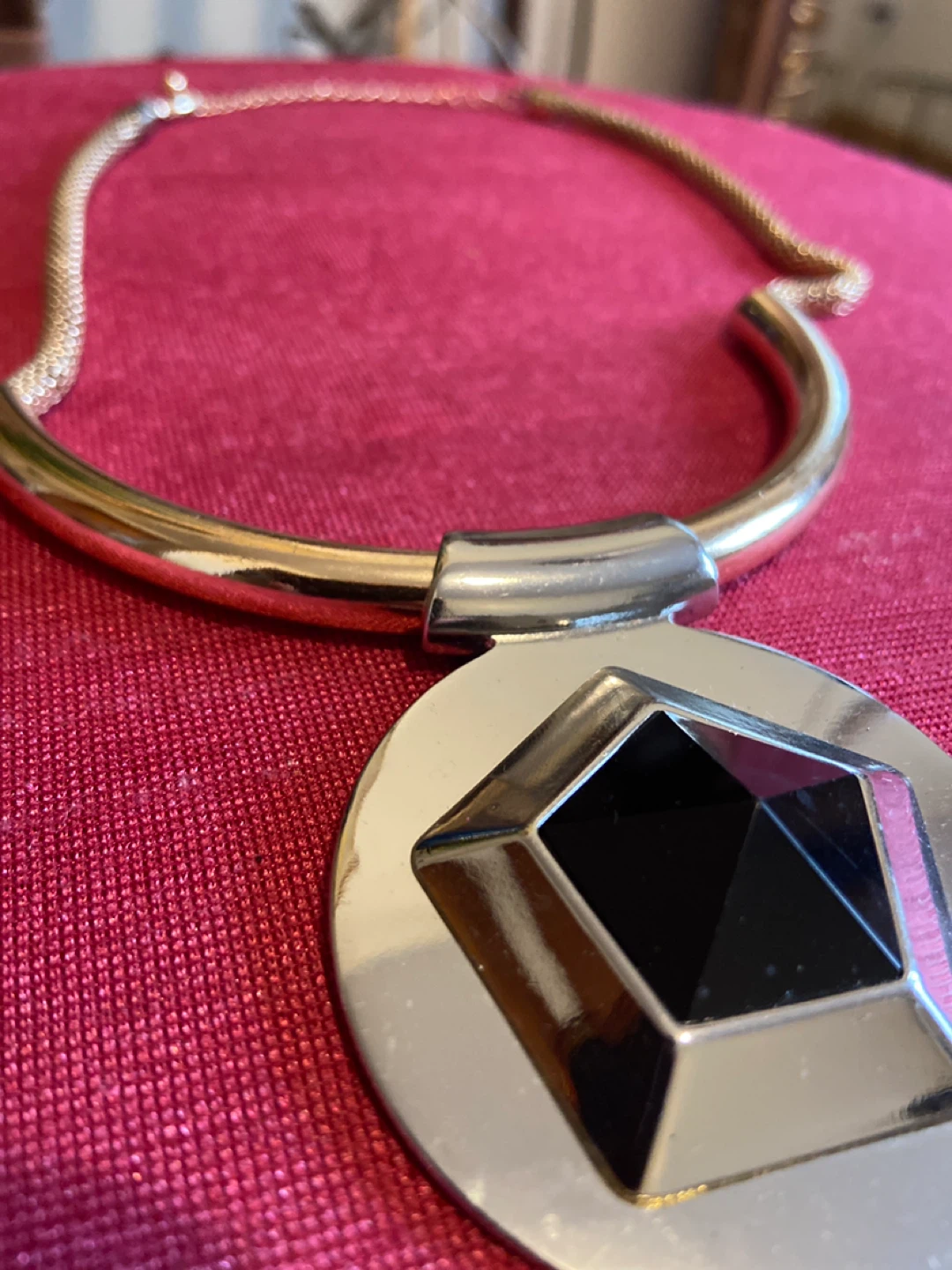 Gold-tone statement necklace with black and silver pendant - photo 2