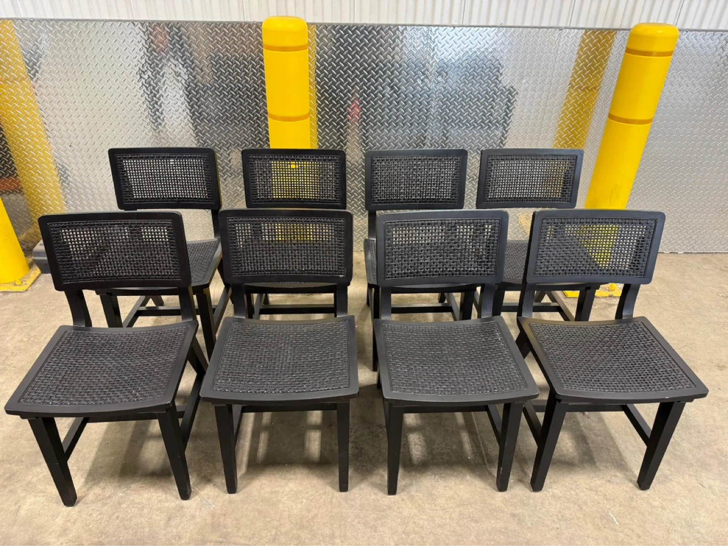 Eight black chairs