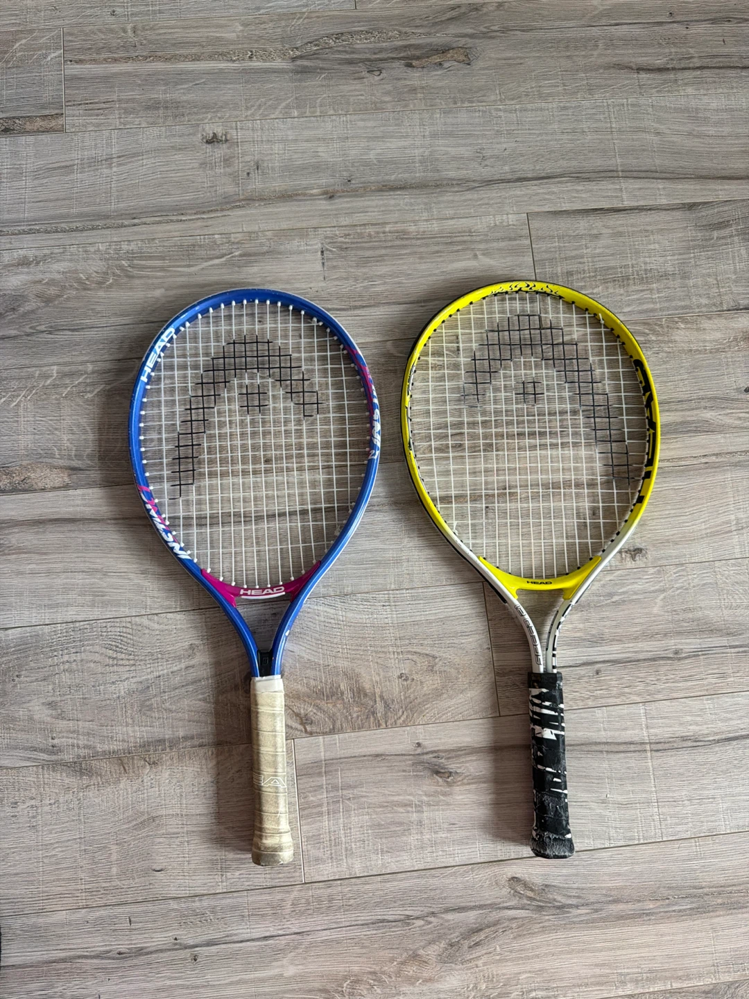 Two HEAD Tennis Rackets - Blue and Yellow
