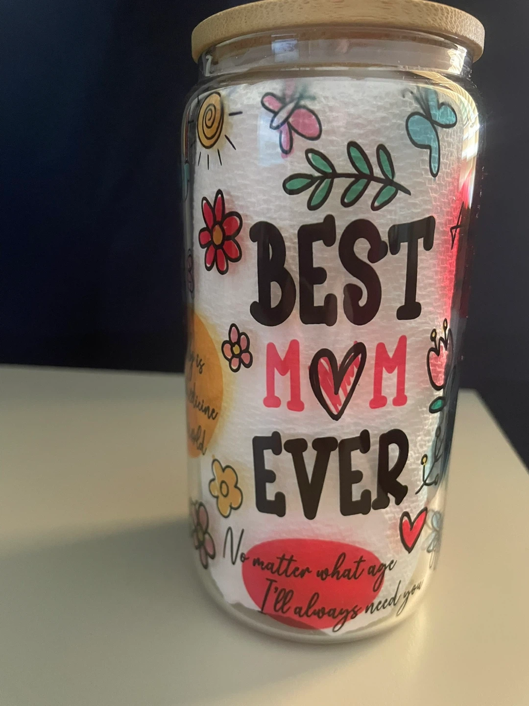 Glass Jar with Mom Themed Graphics comes with a plastic straw