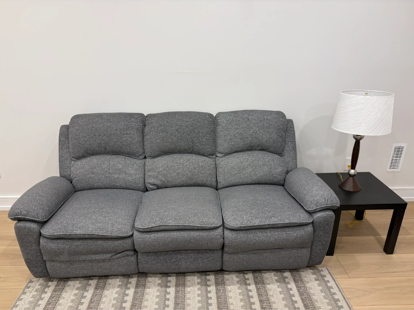 Couch and Striped Area Rug
