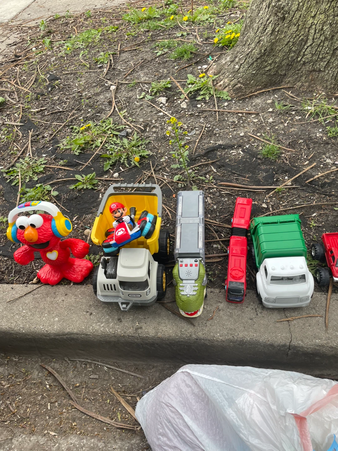 Assorted Toy Vehicles and Elmo Figure