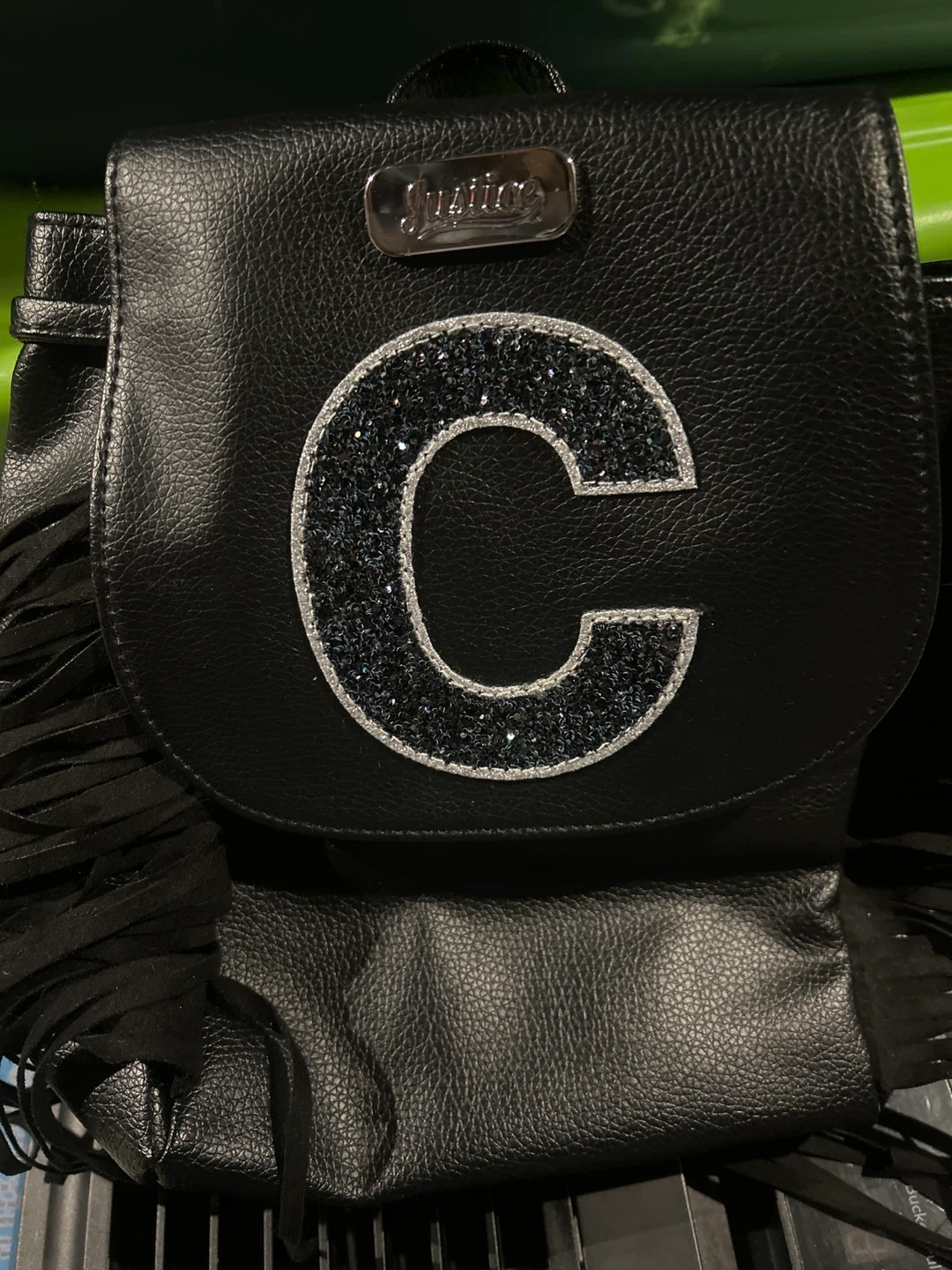 Justice Black Backpack with Glitter Letter C and Fringe