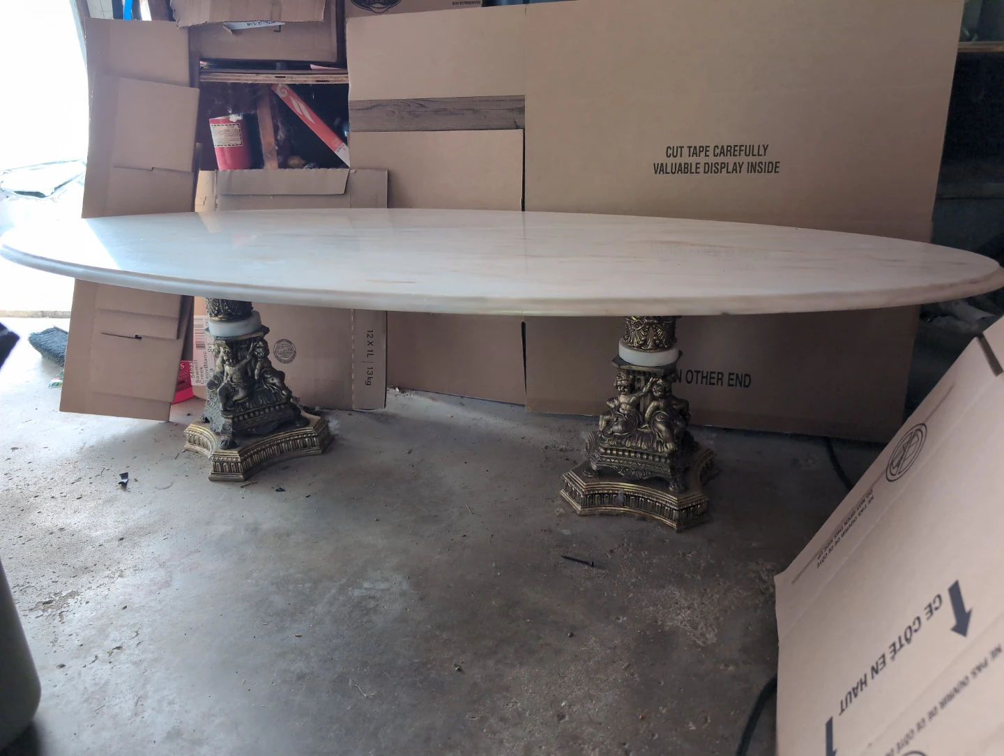 Oval Marble Top Table with Ornate Pedestal Base
