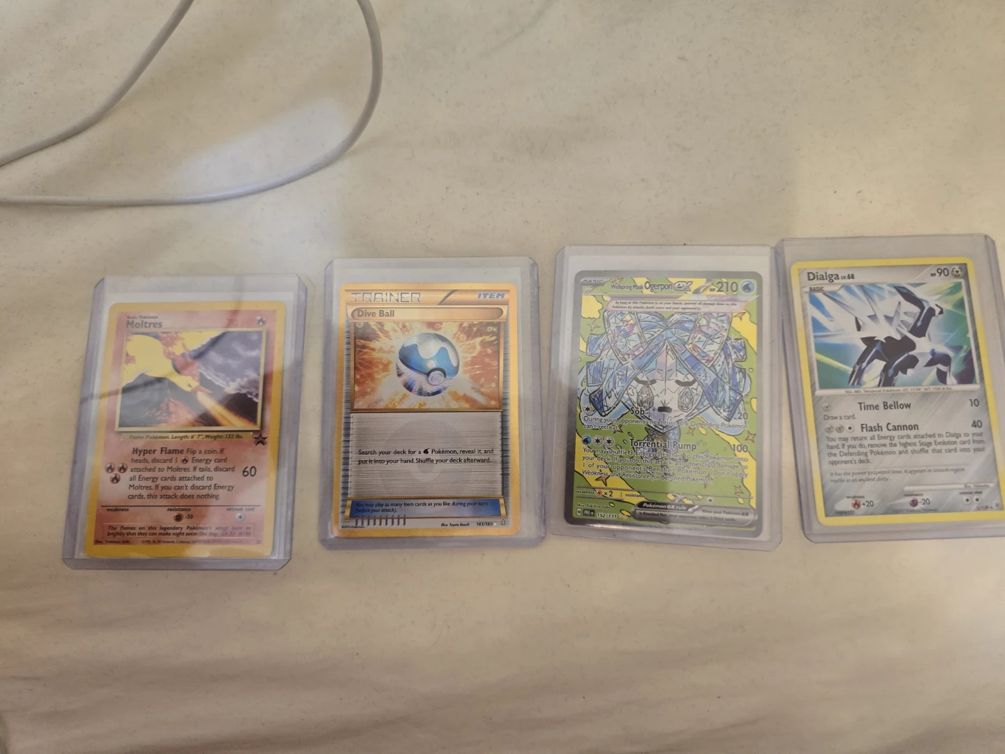 Set of 4 Pokémon Cards - Moltres, Ogerpon V, Dialga