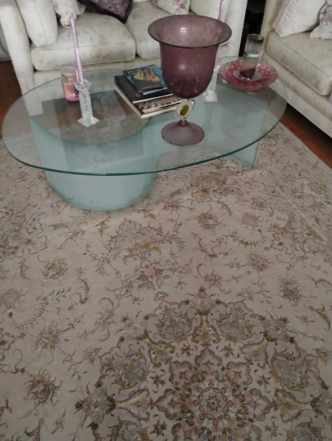 Glass coffee table with modern curved base