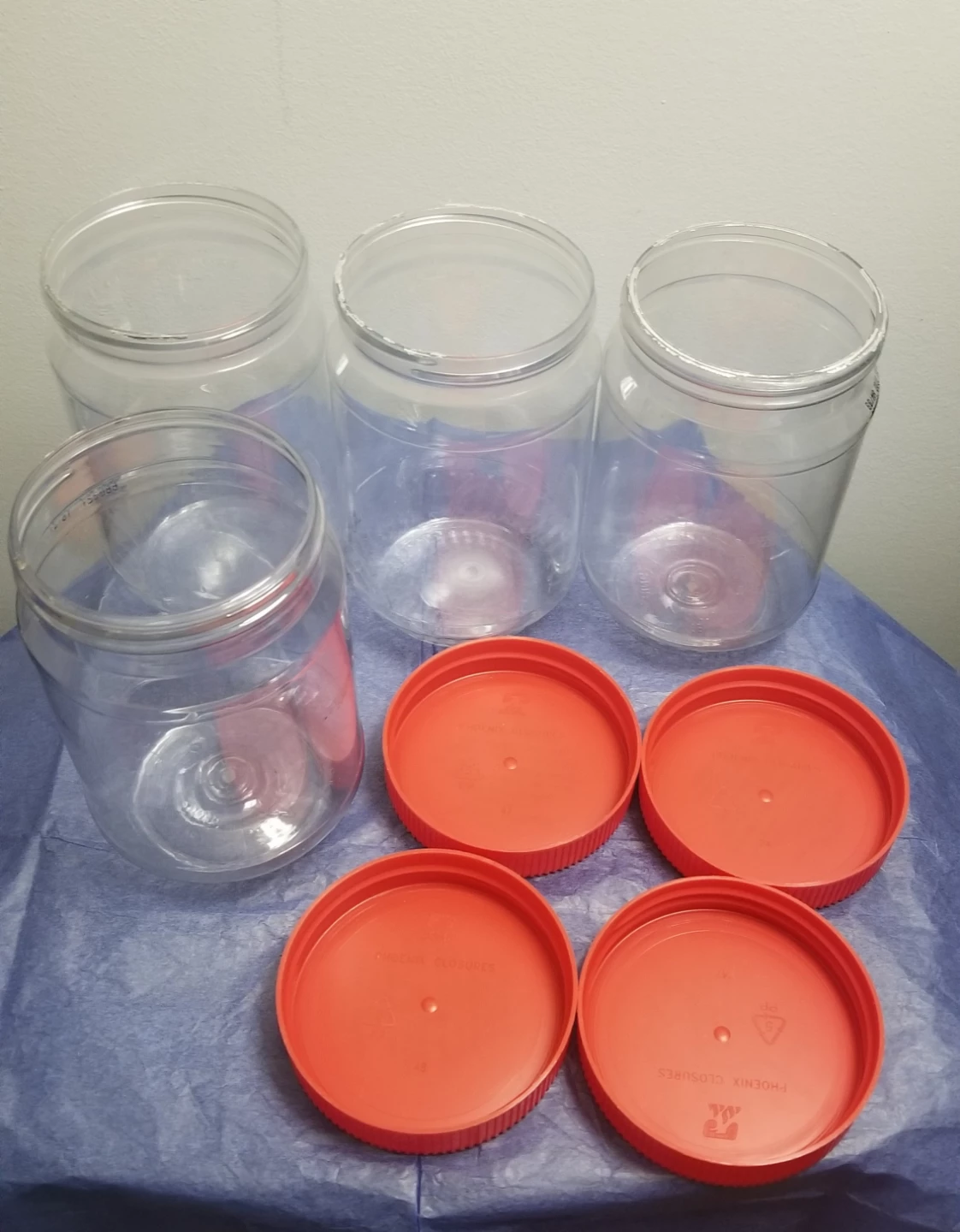 Set of 4 Clear Plastic Jars with  Lids