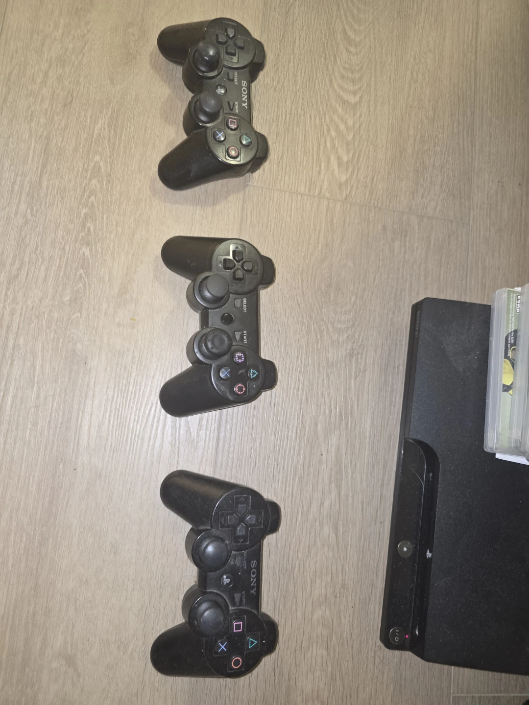 Sony PlayStation 3 Console with 3 Controllers and Games