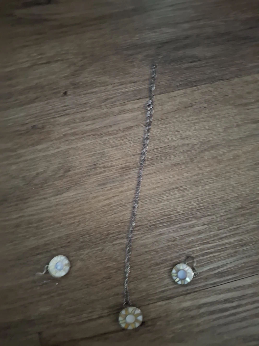 Silver tone pendant necklace with matching earrings