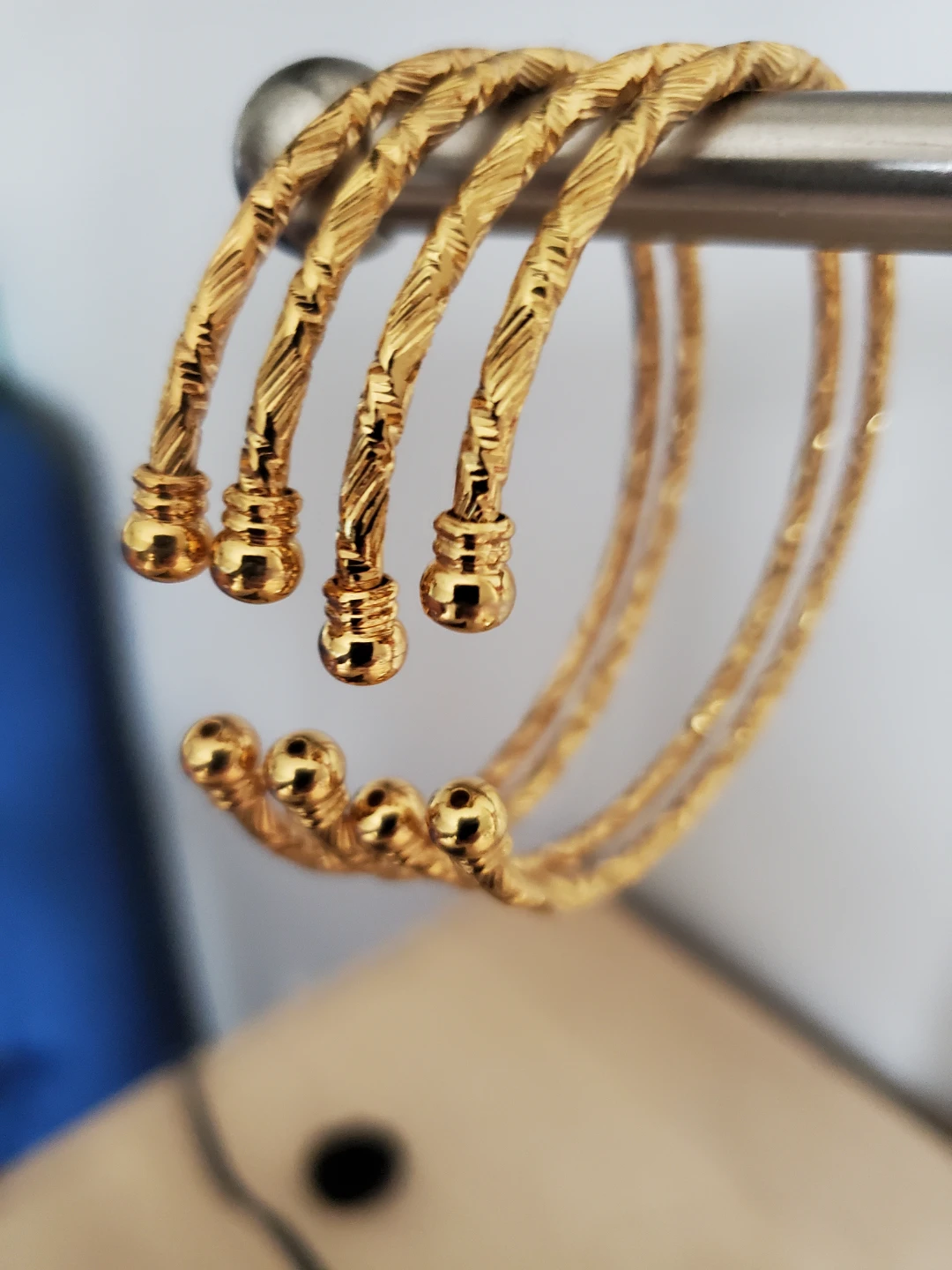 Set of 4 Gold Tone Twist Bangles