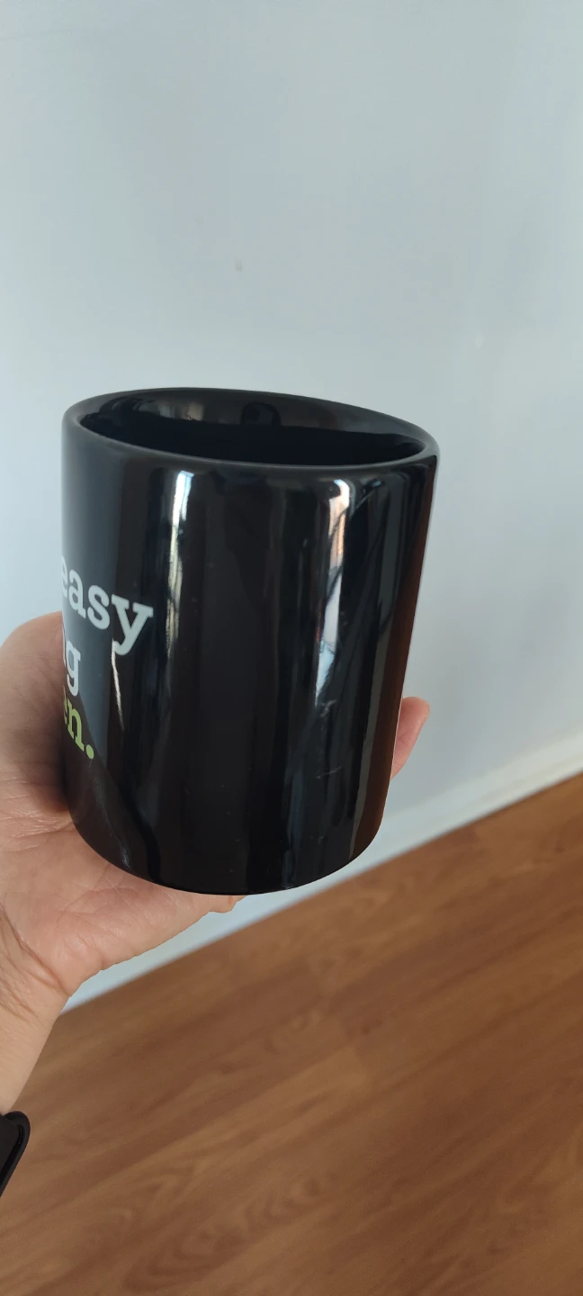 Black Mug with green lettering
