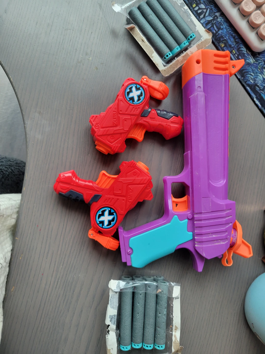 Water gun and two dart guns (with darts)
