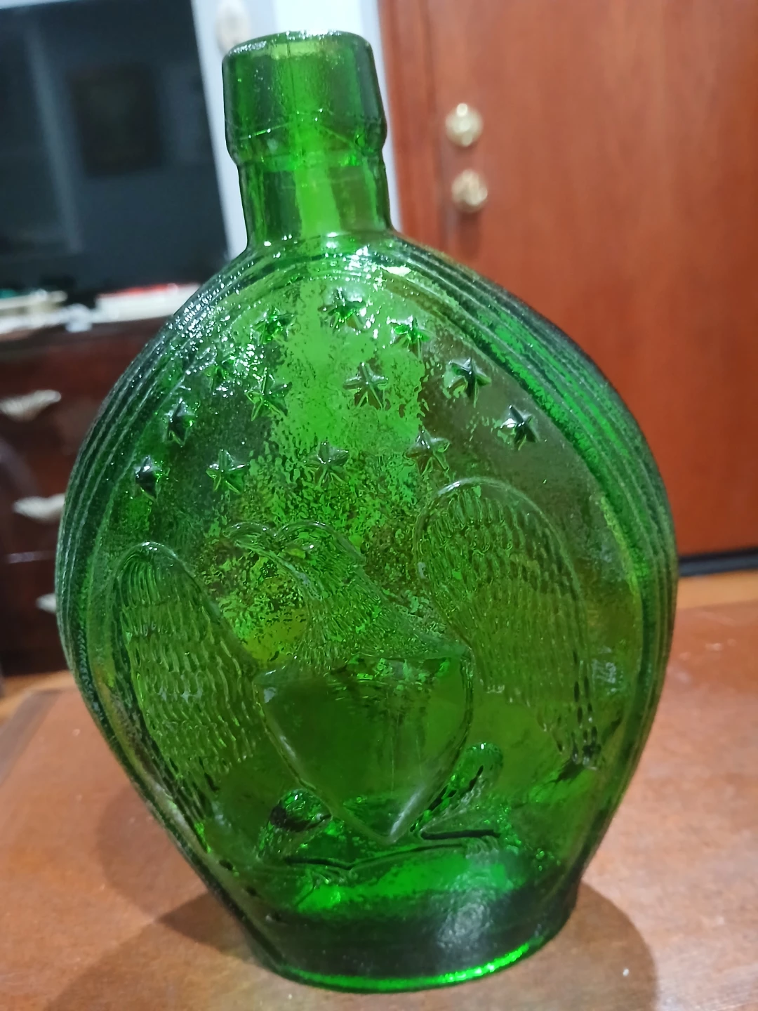 Green Embossed Glass Bottle with Eagle and Grapes Design