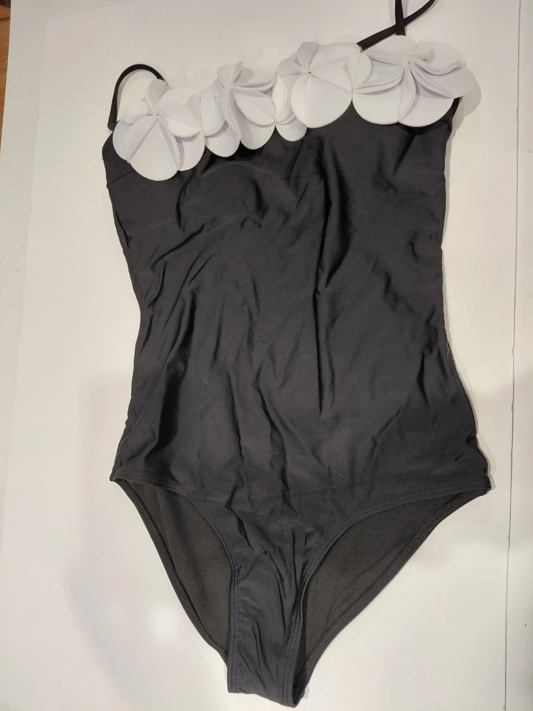 Black One-Piece Swimsuit with White Flower Embellishments