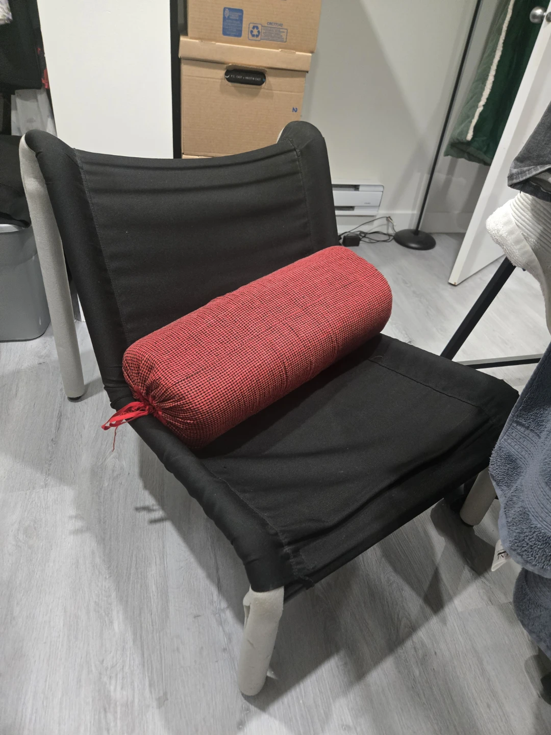 Black lounge chair with red bolster pillow - photo 3