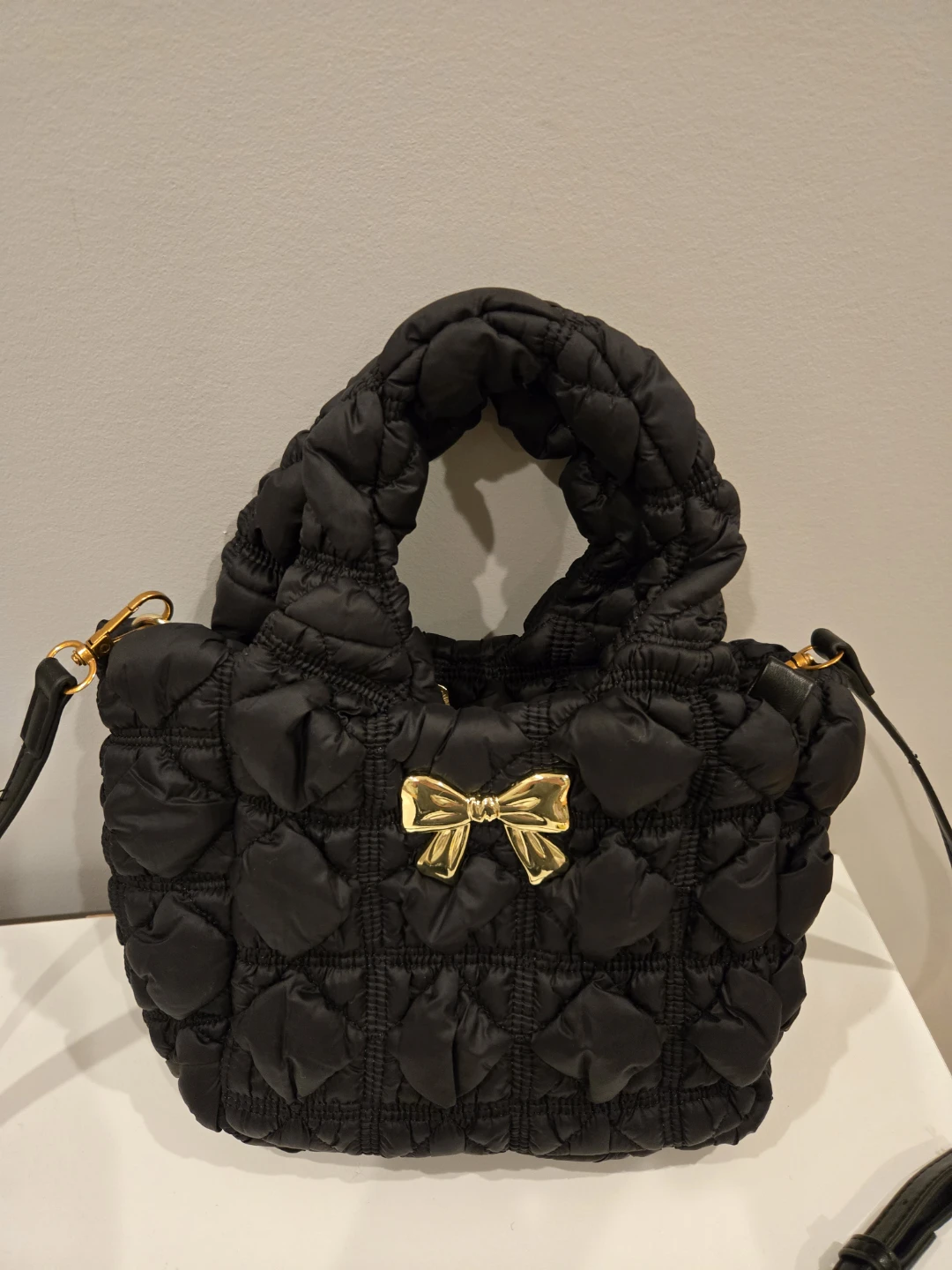Black Quilted Puffer Tote Crossbody Bag with Gold Bow Accent