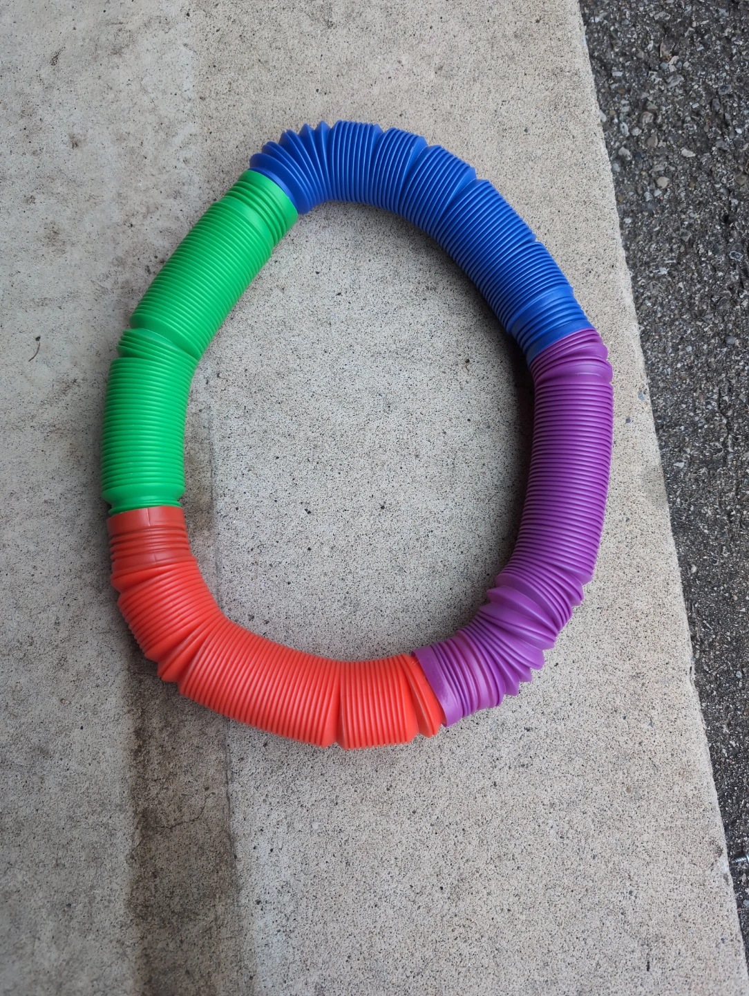 Multi-coloured Pop Tube Toy
