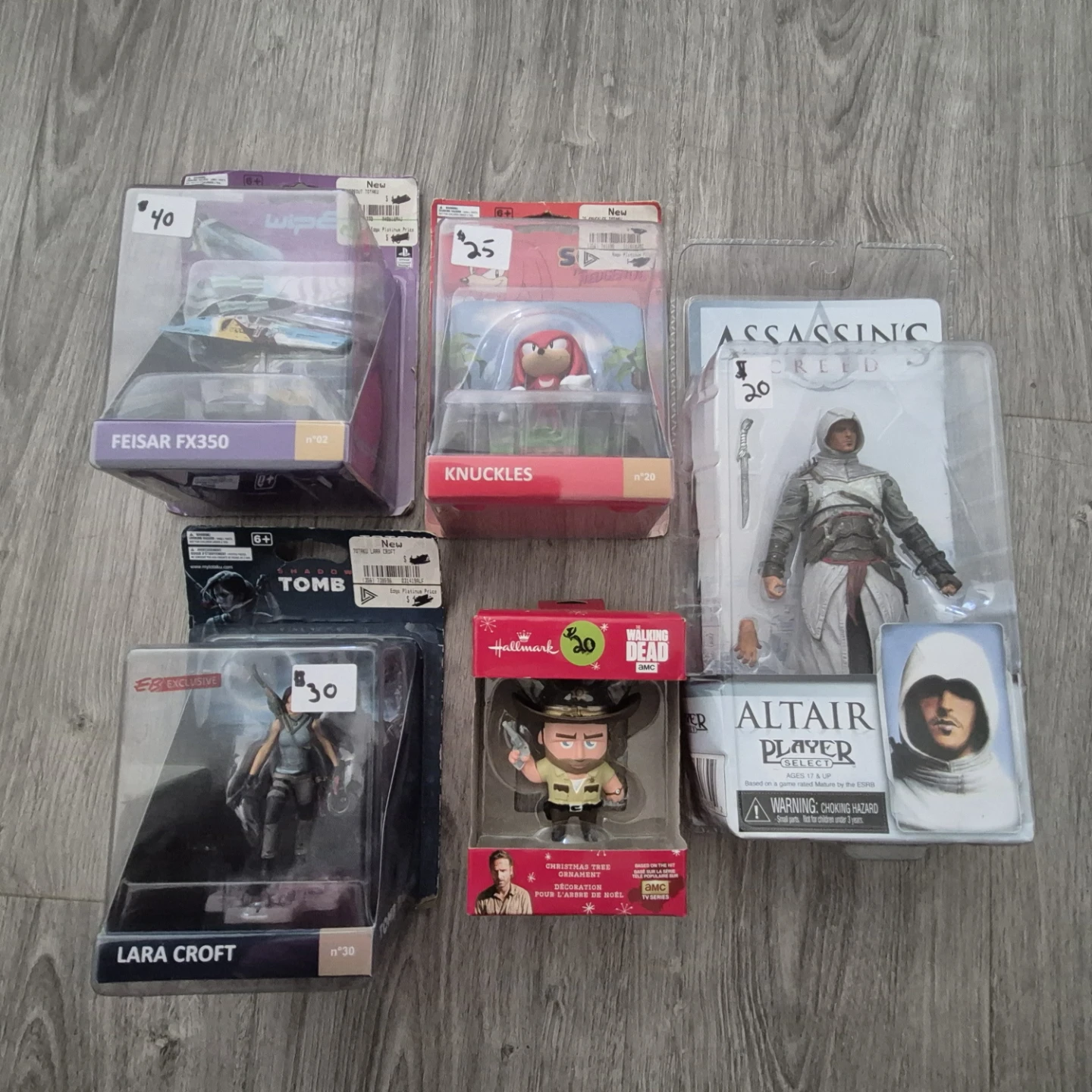 Action Figures: Lara Croft, Knuckles, Altair, and Feisar FX350
