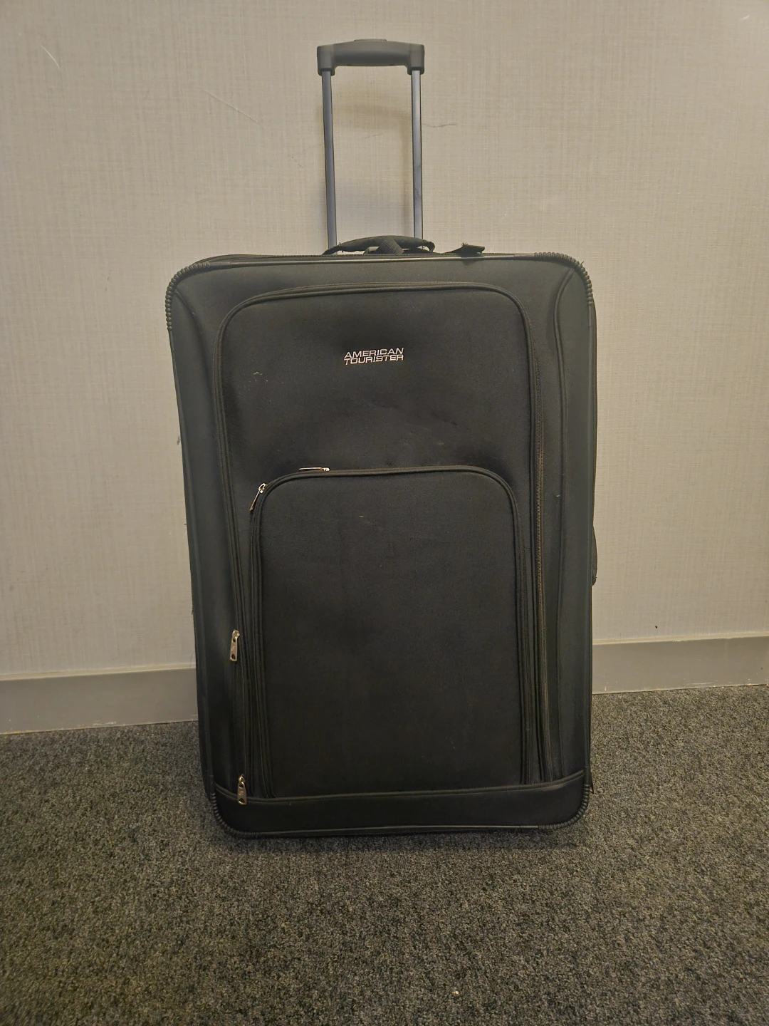 American Tourister Black Rolling Suitcase