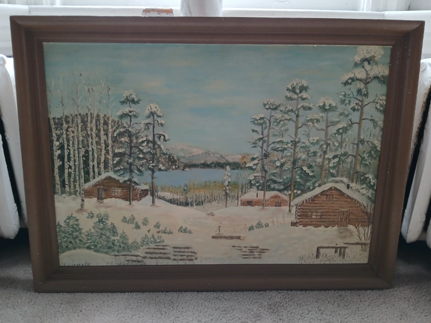 Title: Winter cabins by the lake.