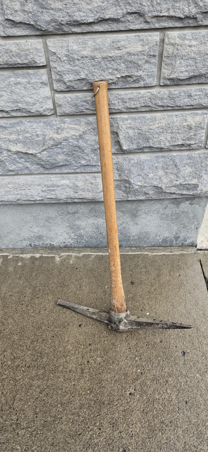 Pickaxe with wooden handle