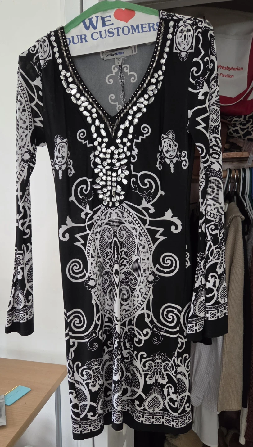 Black and white paisley print dress with embellished neckline