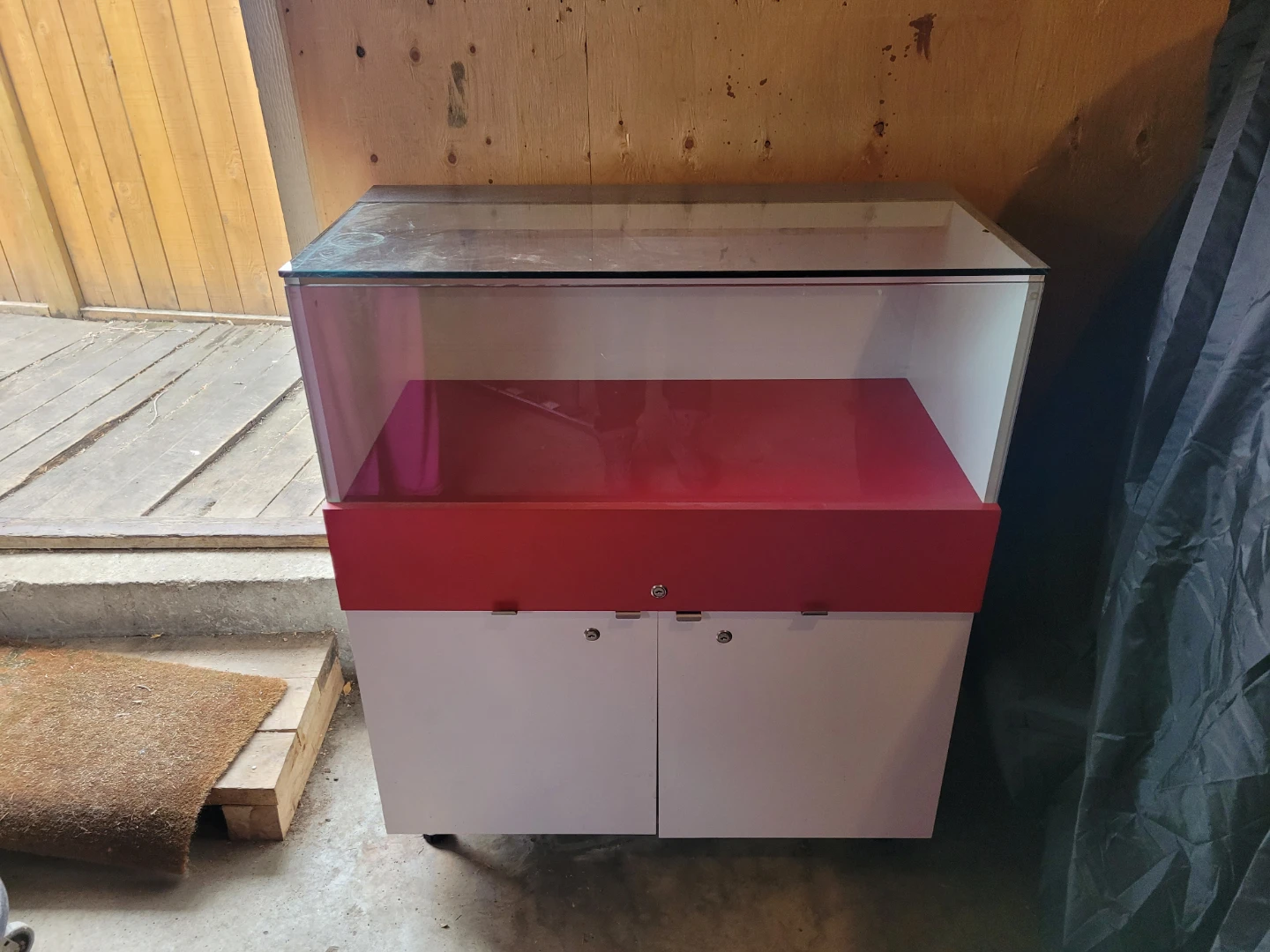 Display Case with Glass Top and Cabinet Storage