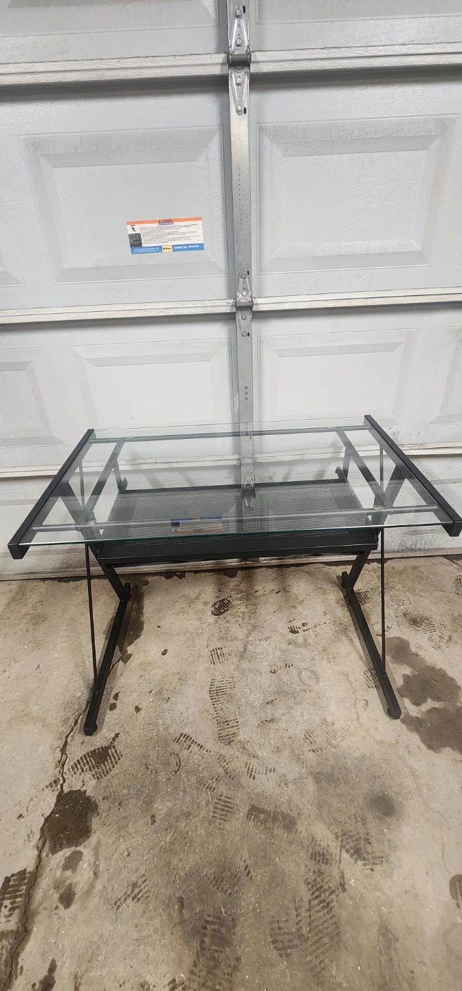 Glass top desk with black metal frame