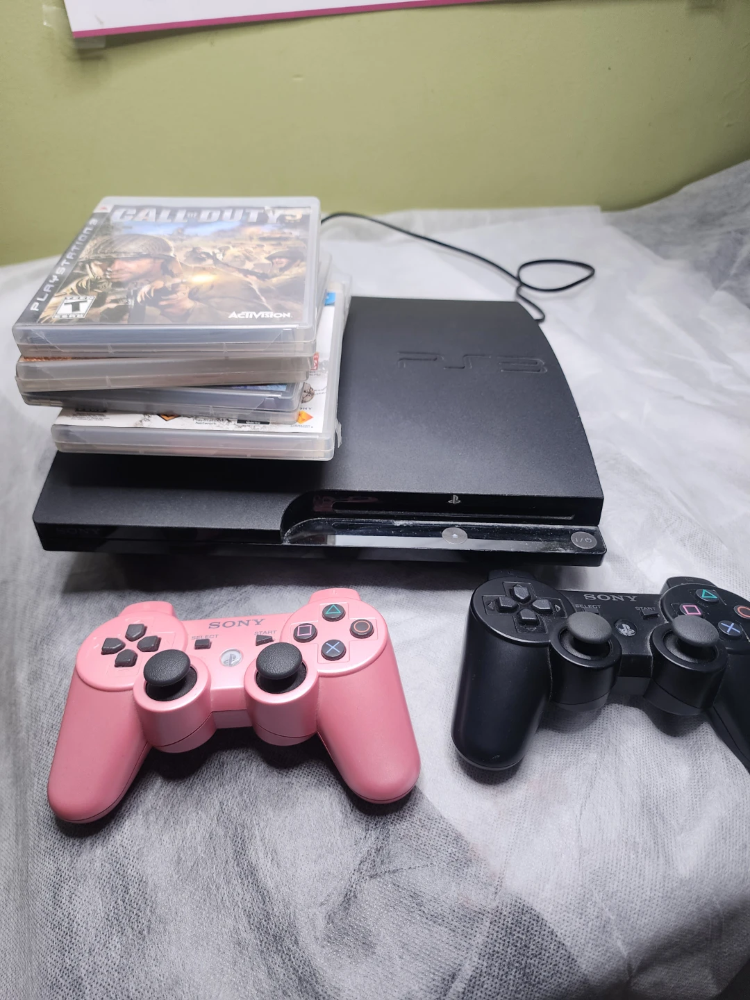 PlayStation 3 Slim Console with 5 Games and 2 Controllers