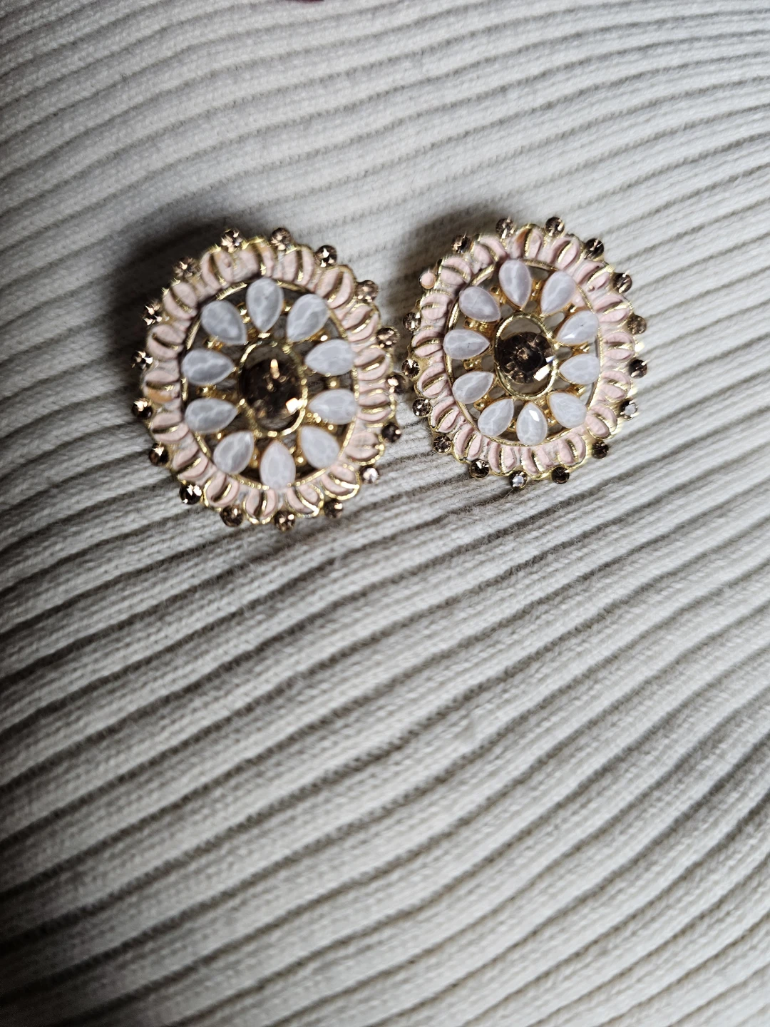 Gold tone flower earrings with pink and white stones
