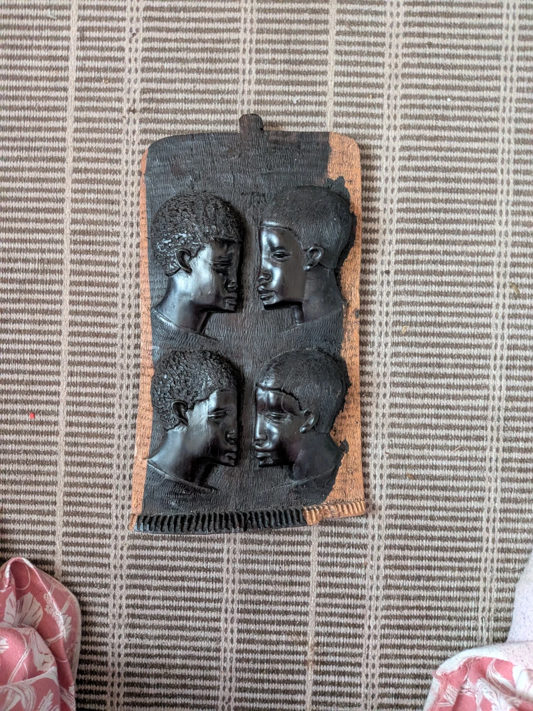 Carved Wood Plaque with Four Faces