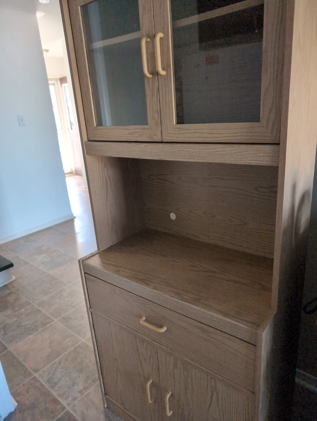 Wooden kitchen hutch with glass doors