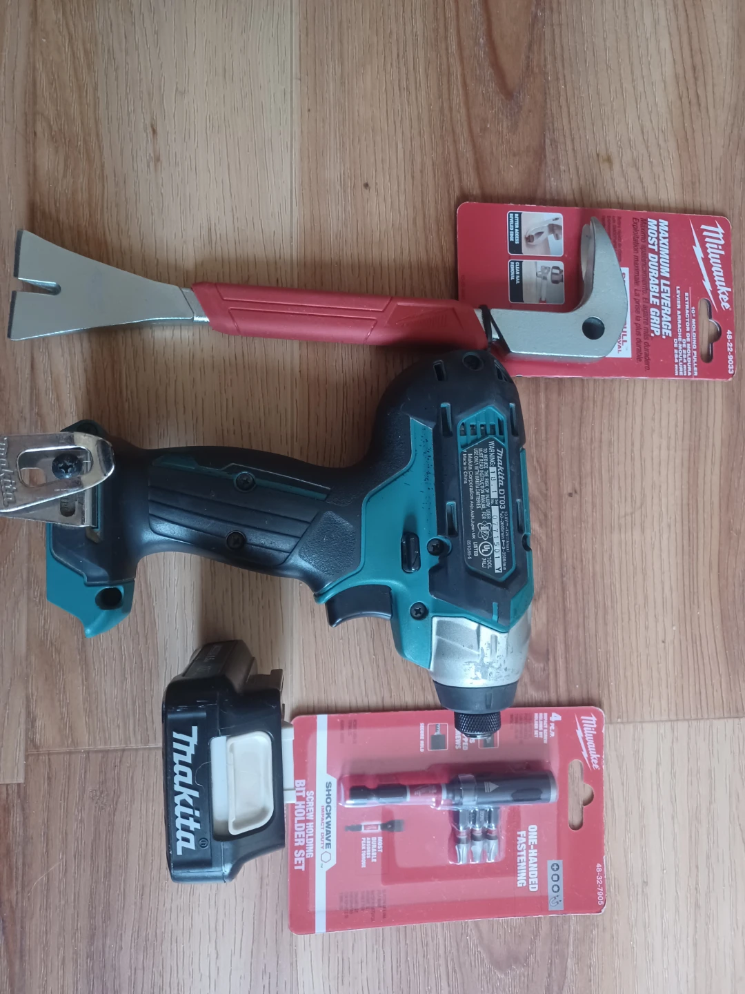 Makita Impact Driver with Milwaukee Pry Bar and Fastening Set